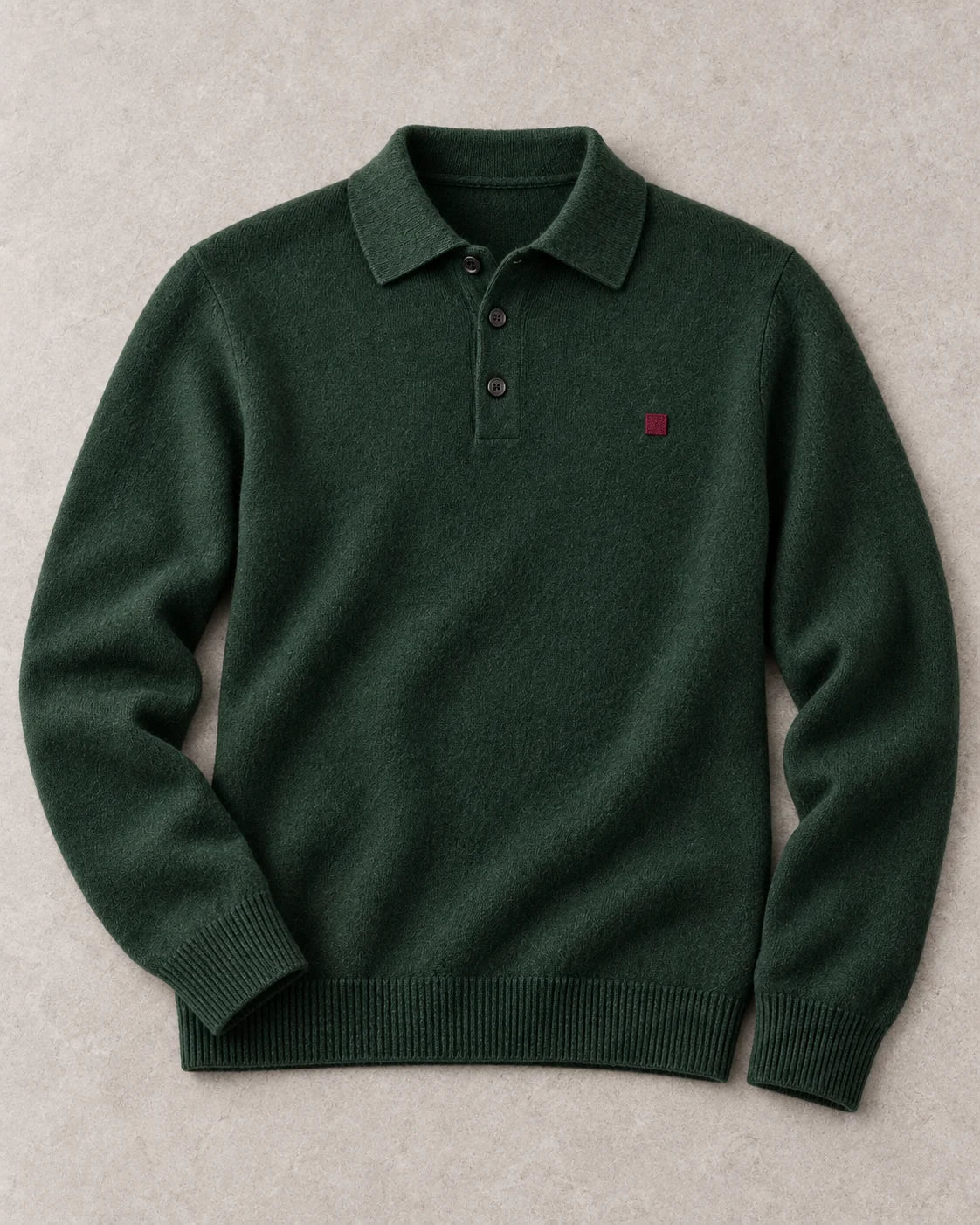 A forest-green cashmere polo with a small embroidered emblem